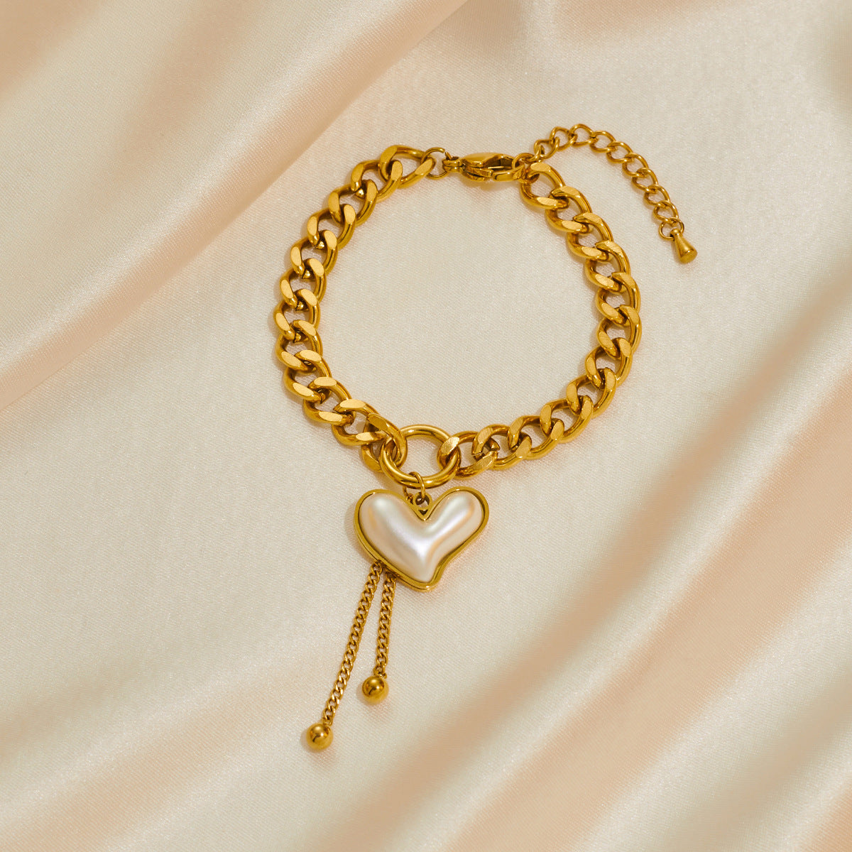 A set of two heart-shaped bright gold accessories